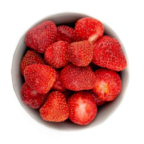 Bowl filled with premium freeze-dried strawberries, showcasing their bright red colour and crispy texture—ideal for healthy snacking, baking, and smoothie toppings.
