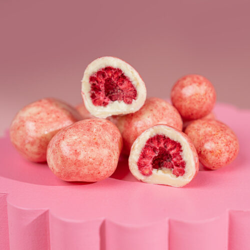 A gourmet treat of freeze-dried raspberries coated in premium white chocolate, offering a perfect balance of tangy fruitiness and creamy sweetness.