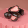 A premium gourmet treat of freeze-dried strawberries coated in rich black chocolate (50%+ cacao), offering a perfect balance of deep cocoa flavour and natural fruit sweetness.