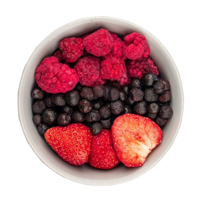 Bowl jar filled with premium freeze-dried mixed berries, including wild blueberries, strawberries, and raspberries, showcasing their vibrant colours and crispy texture—ideal for healthy snacking and culinary use.
