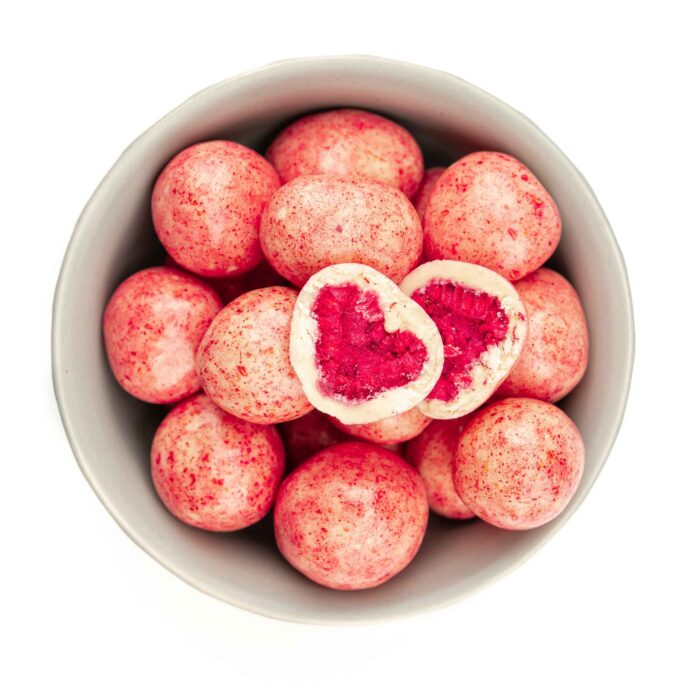 A gourmet treat of freeze-dried raspberries coated in premium white chocolate, offering a perfect balance of tangy fruitiness and creamy sweetness.