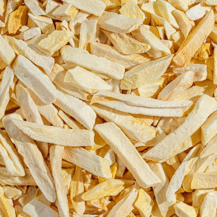 Freeze-Dried Mango | Natures Element (Close View) Freeze-dried mango pieces on pedestal – Natures Element