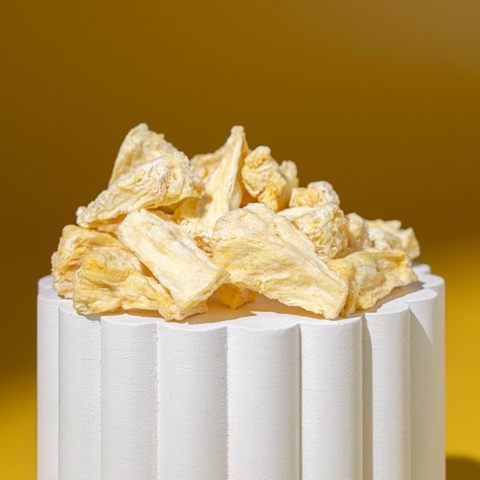 Freeze-Dried Pineapple | Natures Element (Close View) Freeze-dried pineapple pieces on pedestal – Natures Element