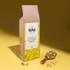 Nature’s Element – Camomile Blossoms Herbal Tea Nature’s Element Camomile Blossoms loose-leaf herbal tea with scoop on yellow background
