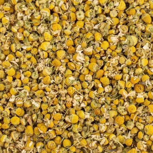 Dried camomile blossoms loose-leaf herbal tea close-up