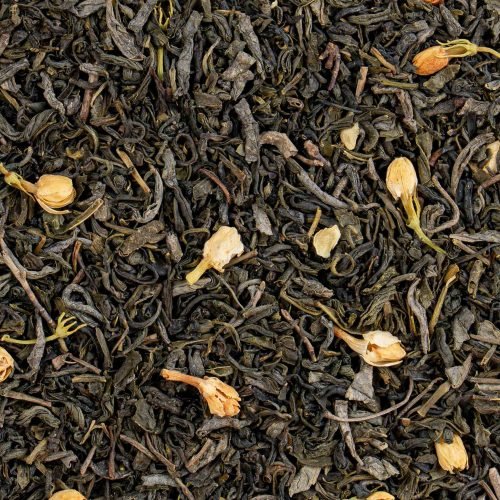 Close-up of Nature’s Element jasmine green tea leaves and blossoms