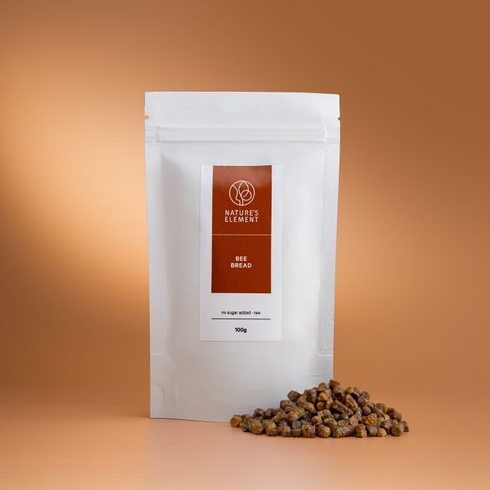 Nature’s Element – Bee Bread 100g Nature’s Element bee bread in white pouch on warm brown background – raw fermented superfood