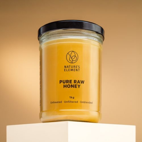 Nature’s Element – Pure Raw Honey 1kg Nature’s Element 1kg pure raw honey in glass jar on beige background – unheated, unblended, unfiltered natural EU honey