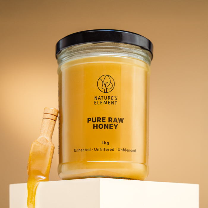 Nature’s Element 1kg pure raw honey in glass jar on beige background – unheated, unblended, unfiltered natural EU honey