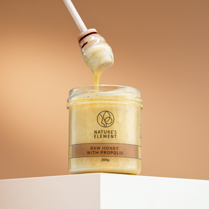 Nature’s Element honey with propolis and wooden dipper – natural immune support honey